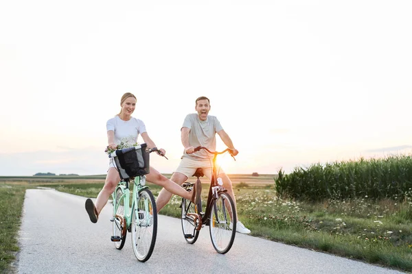 Wide Shot Playful Caucasian Couple Having Fun Bike Village Road — Stockfoto