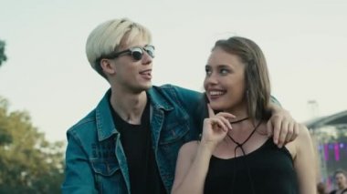 Caucasian couple having fun on music festival together. Shot with RED helium camera in 8K. 
