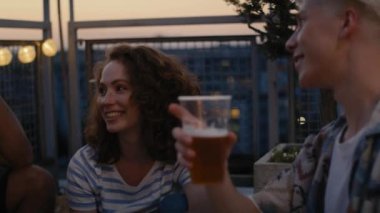 Group of friends have a fun on evening in top of the roof. Shot with RED helium camera in 8K. 