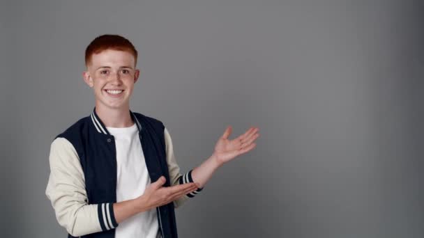 Redhead Boy Looking Camera Pointing Copy Space Shot Red Helium — Stockvideo