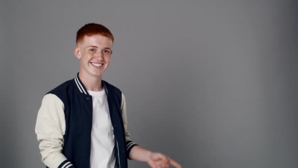 Redhead Boy Looking Camera Pointing Copy Space Shot Red Helium — Stockvideo