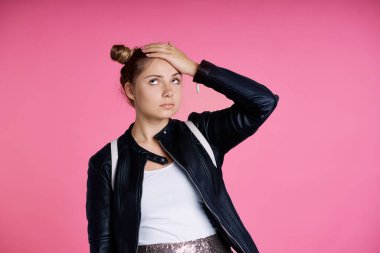 Tired female caucasian teenager with hand on head 