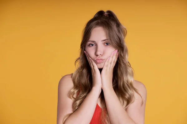 Pretty Caucasian Female Teenager Making Cute Face Yellow Background — Stock fotografie