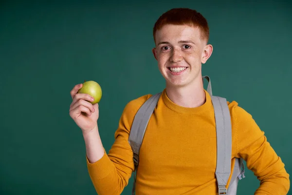 Caucasian Teenage Boy Red Hair Holding Green Apple Raised Hand — Stock fotografie