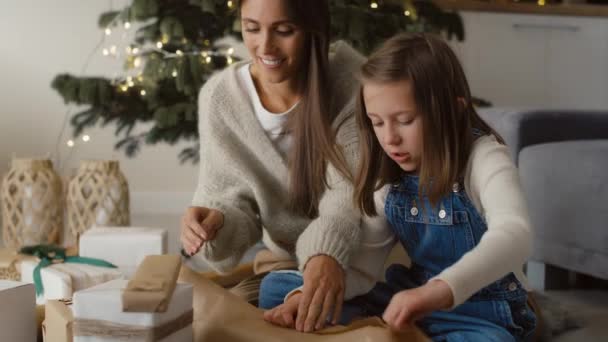 Happy Caucasian Family Packing Christmas Gifts Together Floor Shot Red — Stockvideo