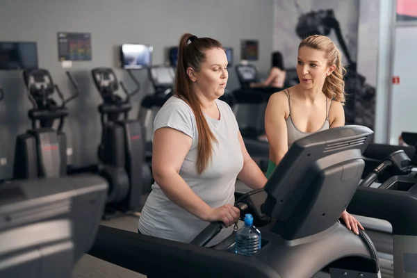 Caucasian Instructor Helping Size Woman Gym — Stock Fotó