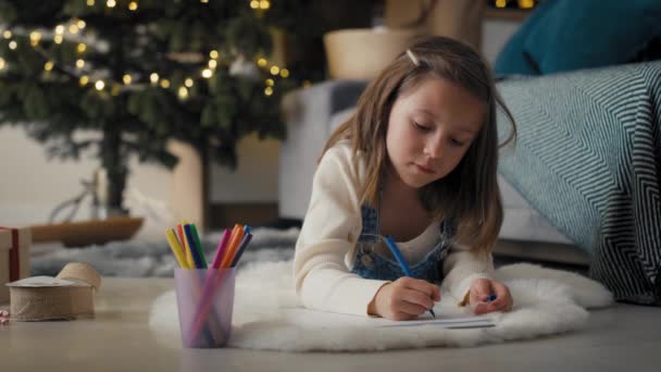 Caucasian Girl Lying Floor Writing Letter Santa Christmas Time Shot — Stock Video