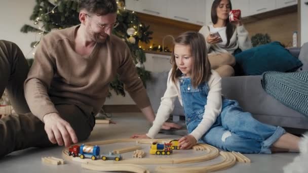Father Daughter Playing Toy Train Together Christmas Time Home Shot — Stock Video