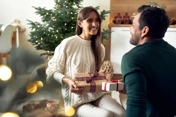 Multi Ethnicity Couple Sharing Christmas Present Together Home — Fotografia de Stock