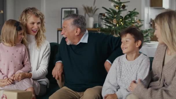 Caucasian Grandfather Giving Christmas Presents His Grandchildren Shot Red Helium — Stock Video