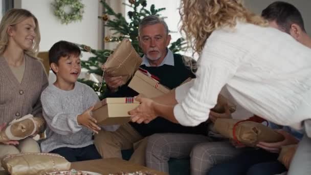 Family Sharing Christmas Presents Together Home Shot Red Helium Camera — Stock Video