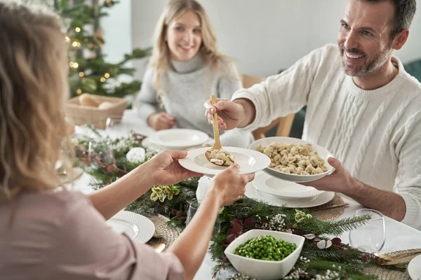 Caucasian Man Sharing Ravioli Christmas Eve — Stock Photo, Image