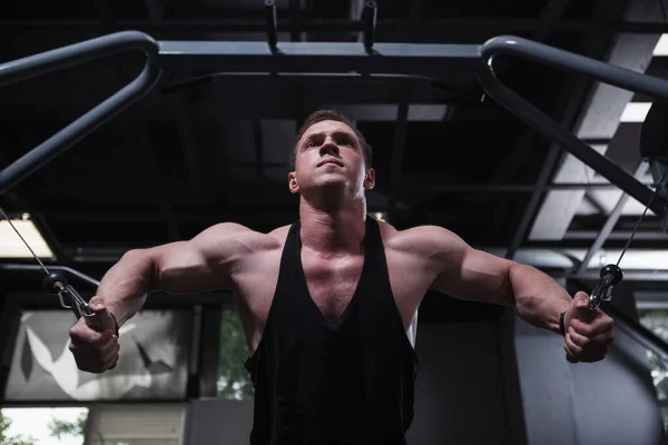 Low Angle Shot Muscular Athlete Looking Focused Training Cable Crossover — 图库照片
