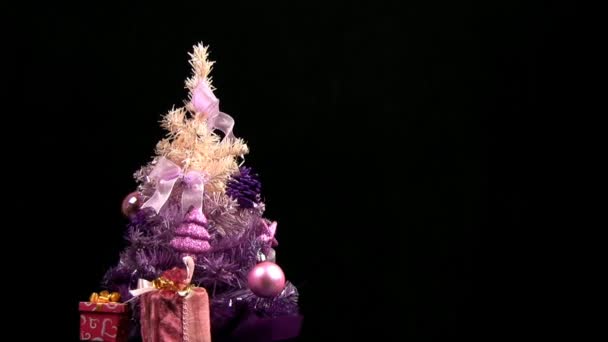 Pink Christmas tree rotates — Stock Video