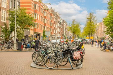 Netherlands. Summer day in Amsterdam. Market street. Lots of parked bicycles