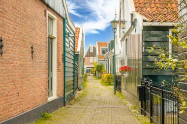 Netherlands. Summer day in Zaandam. Dutch country houses and pedestrian street between