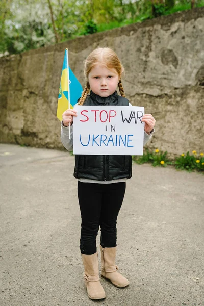 Upset Poor Toddler Girl Kid Protesting War Conflict Raises Banner — стоковое фото