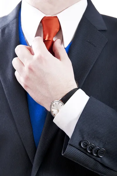 Business Man Adjusting Orange Necktie — Stock Photo, Image