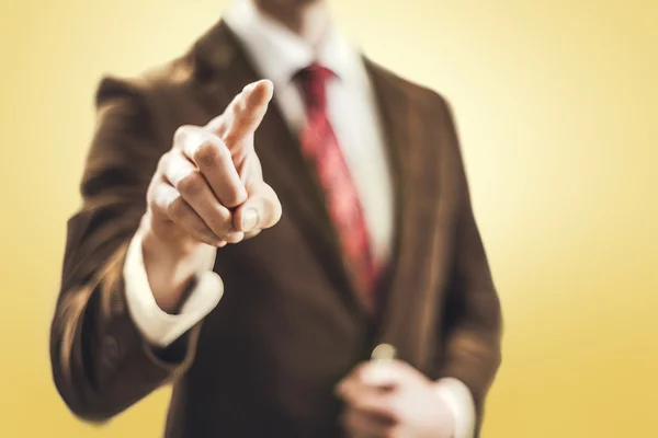 Business man pointing towards camera — Stock Photo, Image