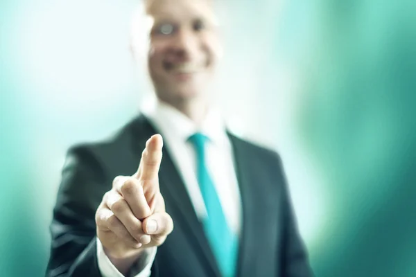 Business man pointing towards camera — Stock Photo, Image