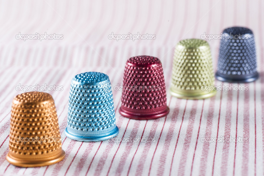 Colored Metallic Thimbles on Fabric
