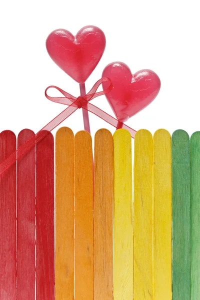 Lollipops and wooden fence — Stock Photo, Image