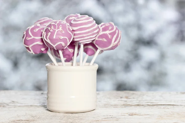 Pink cake pops on winter background — Stock Photo, Image