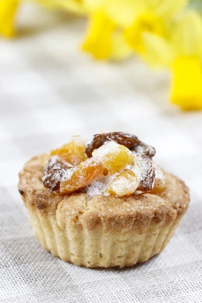 Homemade tarts with dried fruits on checked table cloth — Stock Photo, Image