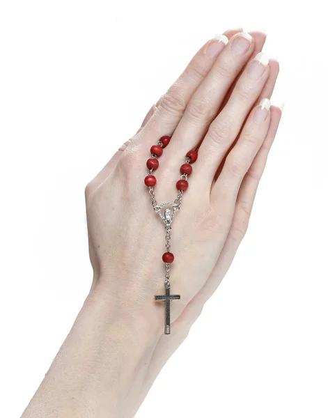 Manos sosteniendo un rosario — Foto de Stock
