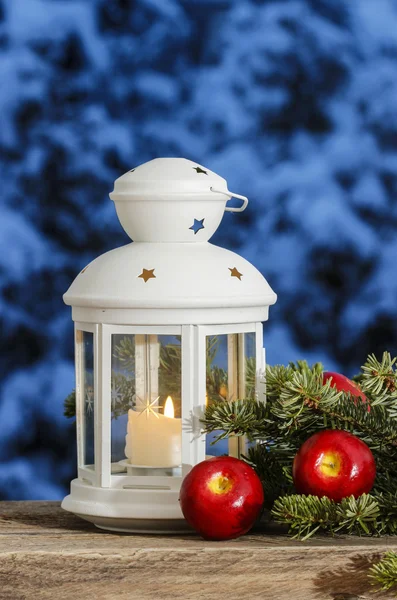 Beautiful white lantern on snowy evening landscape. Christmas de — Stock Photo, Image