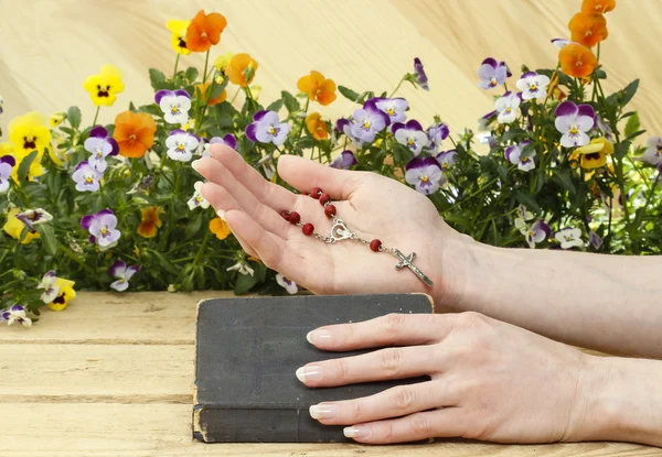 Prayer over old Holy Bible. Wooden background. — Stock Photo, Image