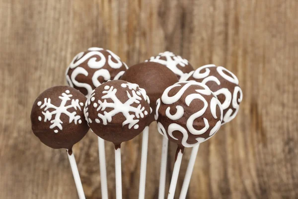 Chocolate cake pops on wooden background. Copy space. — Stock Photo, Image