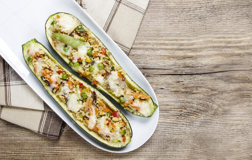 Zucchini stuffed with couscous vegetable salad