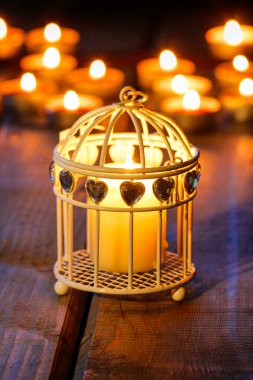 Oriental lantern on wooden table in the evening. Selective focus