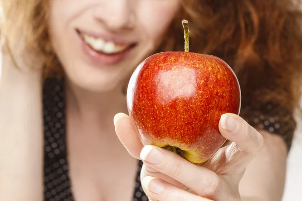 Young girl holding an apple — Stock Photo, Image