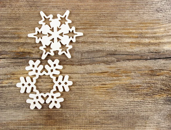 Snowflakes made of wood on wooden background — Stock Photo, Image