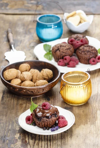 Chocolate cake, bowl of nuts, lanterns and cookies — Stock Photo, Image