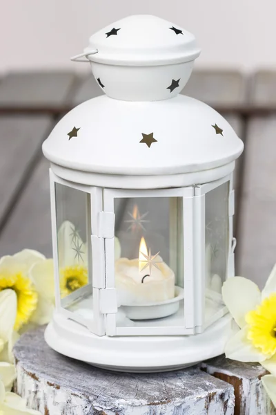 Beautiful white lantern with burning candle — Stock Photo, Image