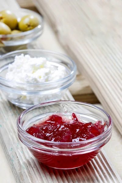 Various appetizers: olives, cranberry, cottage cheese — Stock Photo, Image