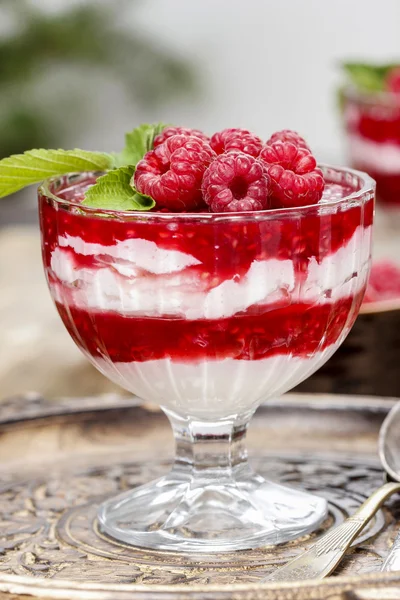 Raspberry dessert on wooden table — Stock Photo, Image