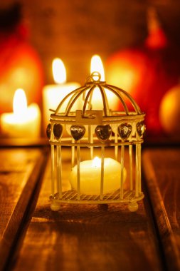 Oriental lantern on wooden table in the evening. Selective focus