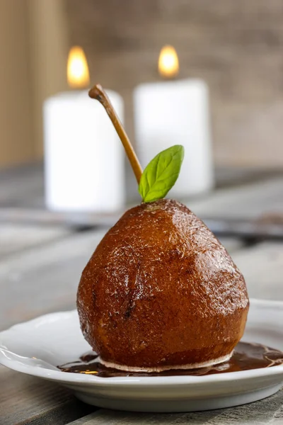 Pear with chocolate sauce. French dessert. Selective focus — Stock Photo, Image