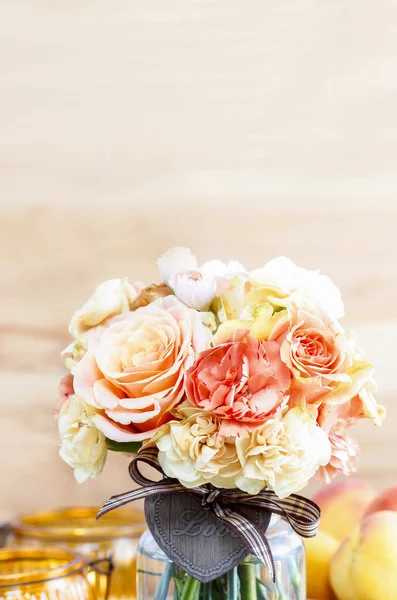 Bouquet of roses and carnations on wooden background. Copy space — Stock Photo, Image