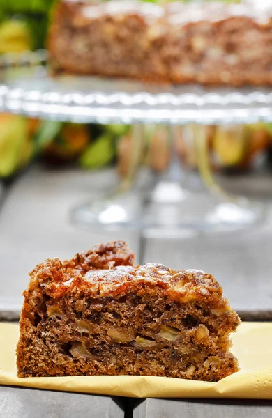 Pieces of nut cake on wooden table. — Stock Photo, Image