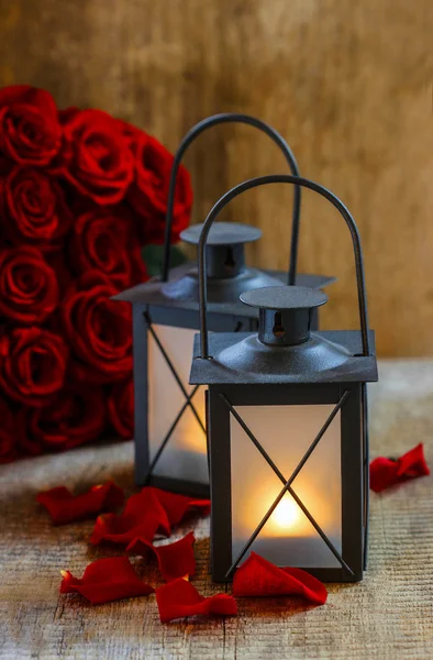 Beautiful iron lanterns on wooden table. Romantic mood, stunning — Stock Photo, Image