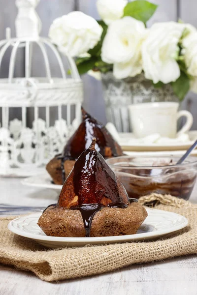 Pear in cake with chocolate sauce — Stock Photo, Image