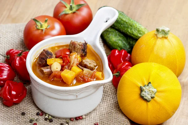 Top view of tomato soup with fresh vegetables and meat — Stock Image Top view of tomato soup with fresh vegetables and meat Royalty Free Stock Photos