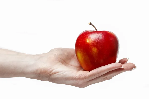 Woman holding red ripe apple in beautiful hand — Stock Photo, Image