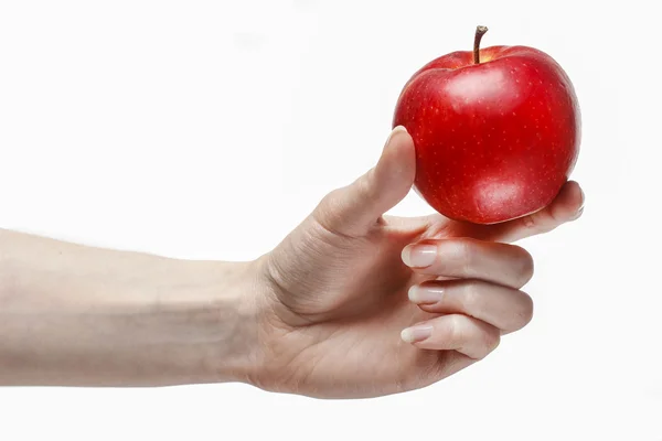 Woman holding red ripe apple in beautiful hand — Stock Photo, Image