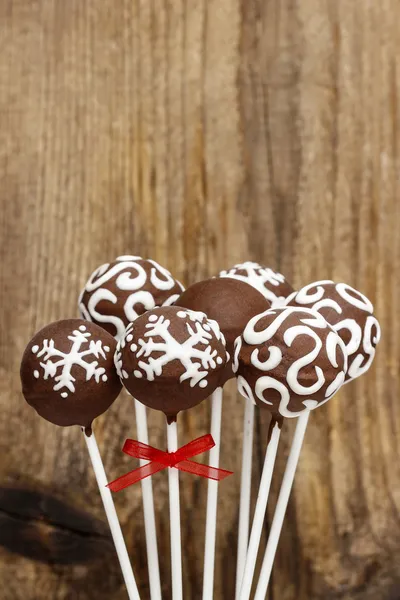 Chocolate cake pops on wooden background. Copy space. — Stock Photo, Image
